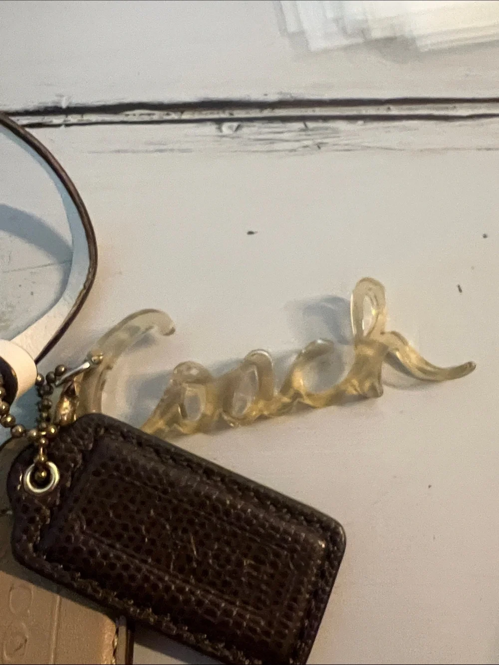 Coach White Tassel Keychain with Gold Script Charm